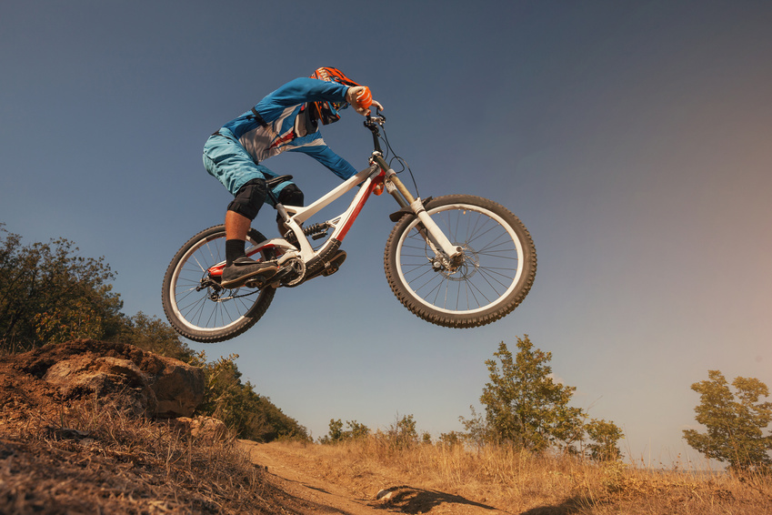 Mountain Bike cyclist jumping. Downhill biking.
